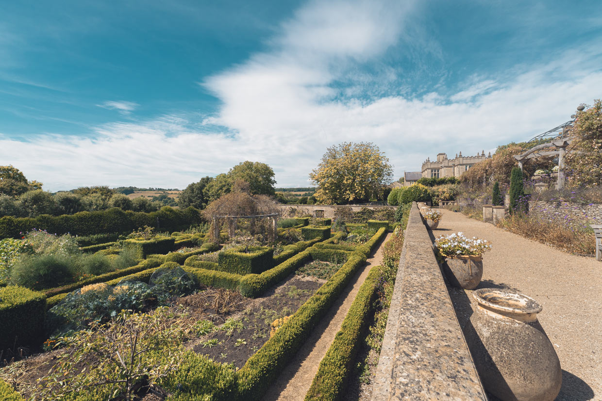 View over the boxwood-bordered beds of the monastery garden.
